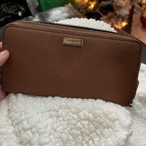 Brown (tan or nude) Kate spade wallet.